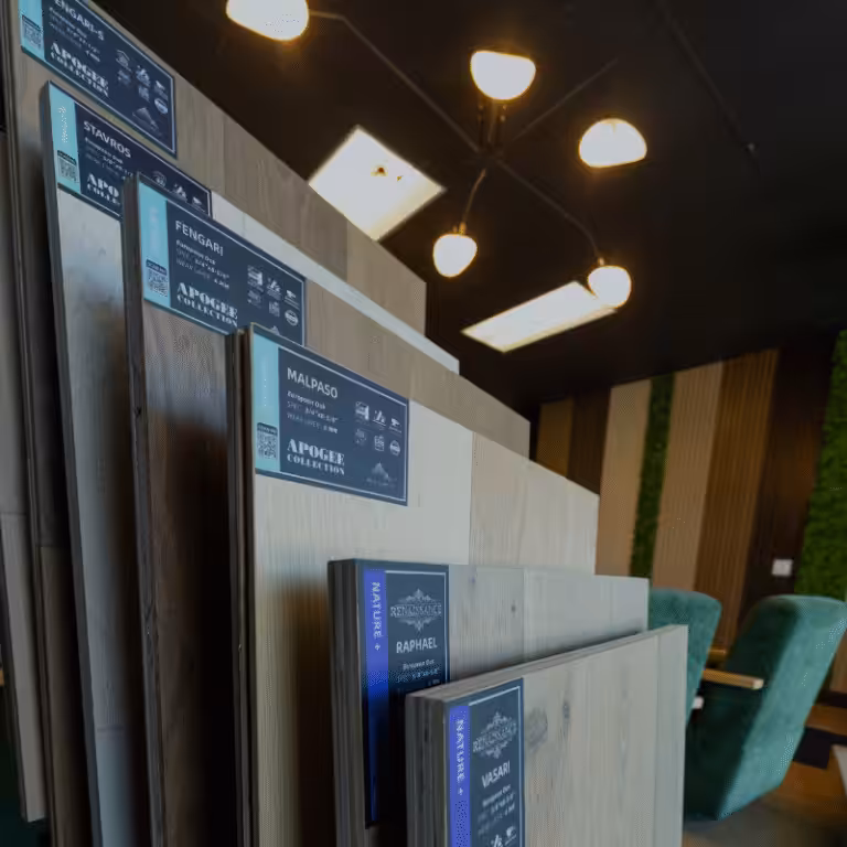 Large sample boards of Denali Hardwood Floors Apogee and Renaissance engineered oak standing in a TRD Floor Supplies showroom