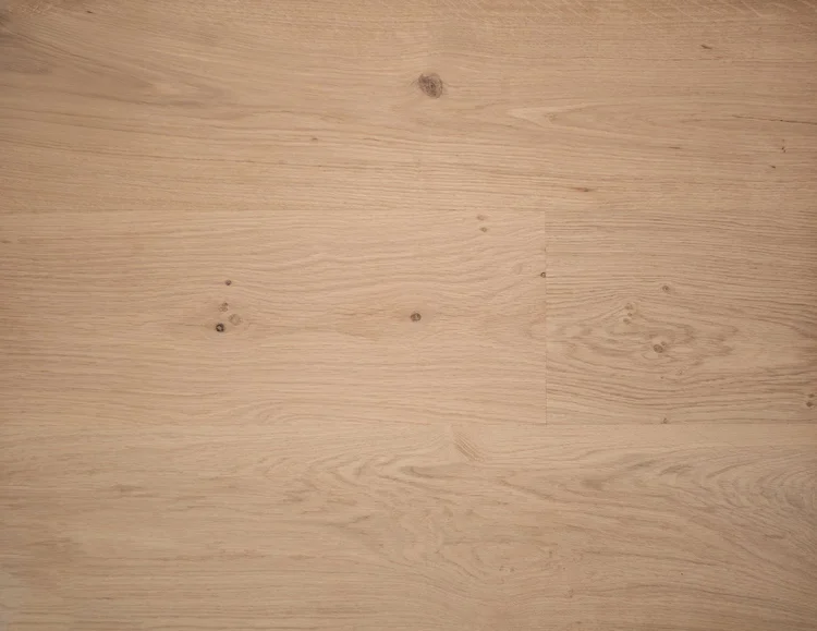 Prefinished vs Unfinished Hardwood: Same Wood, Different Finish Day Bare, unfinished pre-sanded European oak planks with light grain and small knots