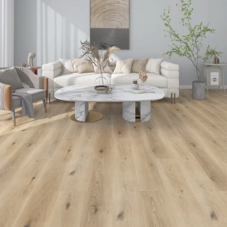 SPC vs WPC Flooring: Four Questions That Pick the Right Core Living room with light oak-look Belocore SPC Latte vinyl plank flooring, a white sofa and a marble coffee table